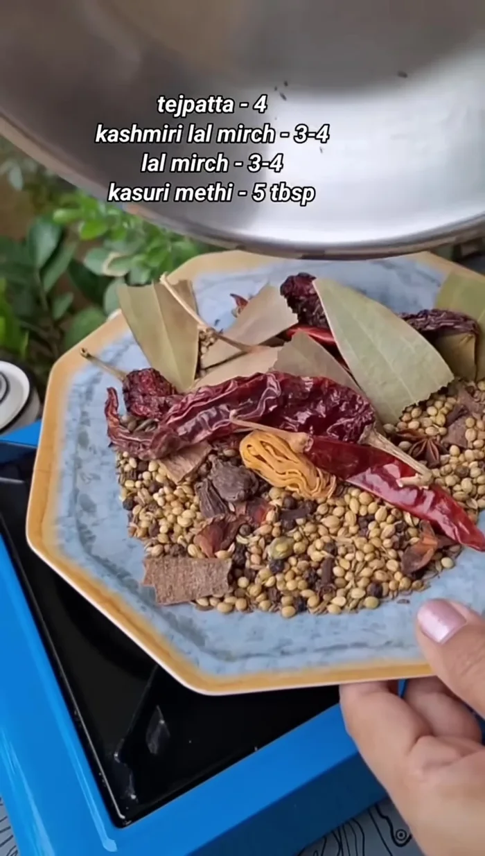 Remove the chilies from the pan and add them to the bowl with the other spices.