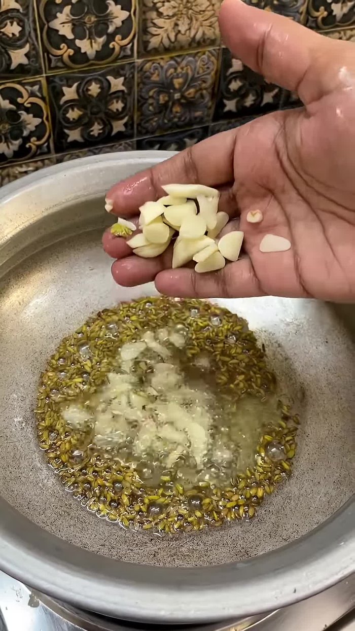 Take 15 cloves of garlic, chop them finely, and fry them well in the oil.