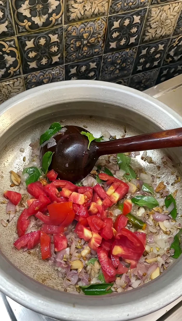Chop one or three tomatoes and add them. Fry everything well until completely cooked.