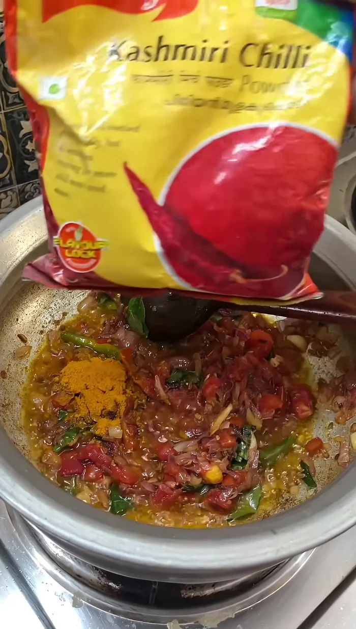 Add 1/2 spoon of turmeric powder, Kashmiri chili powder, and two tablespoons of ours powder.