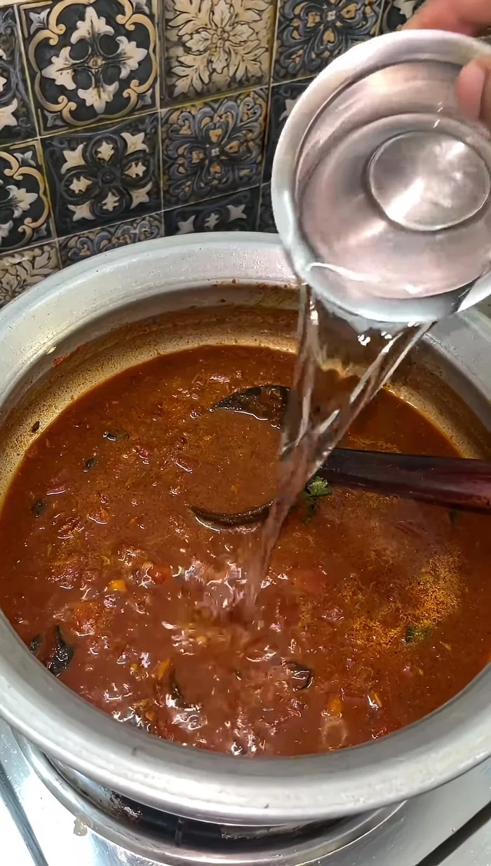 Add a glass of water, mix well, and bring to a boil.