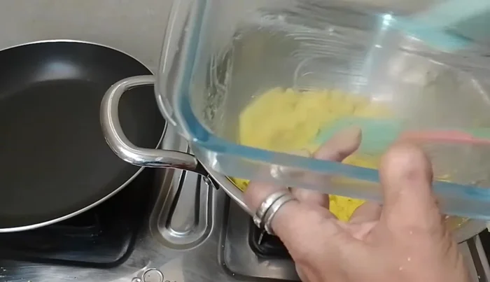 Grease a sweet dish with ghee to prevent sticking.