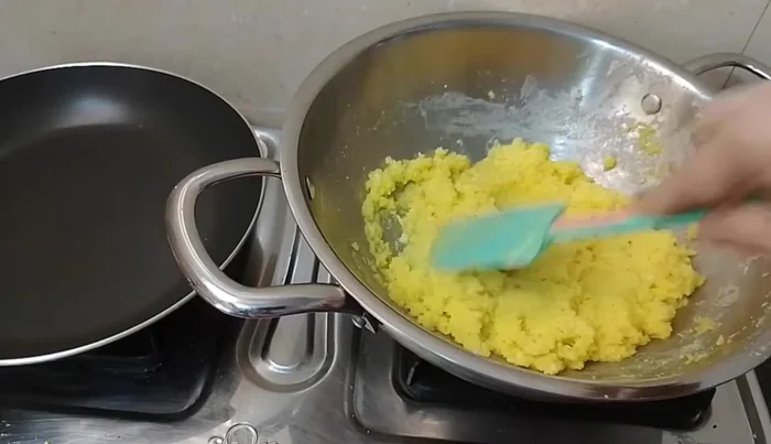 Test for doneness: Take a small amount of the mixture, form a ball. If it holds its shape, it's ready.
