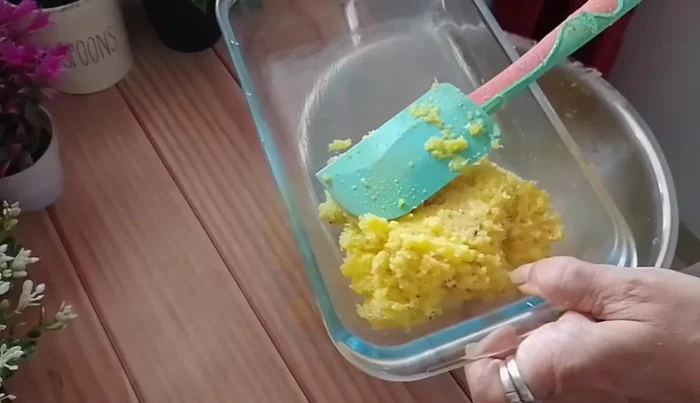 Pour the mixture into the greased dish and spread evenly to desired thickness.