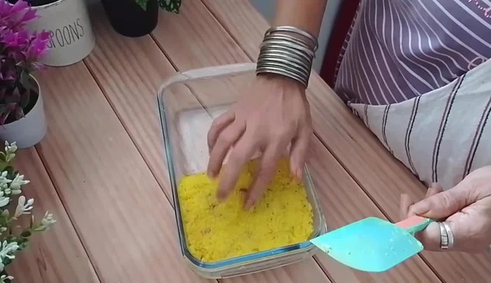 Gently tap the set barfi to release any air bubbles.