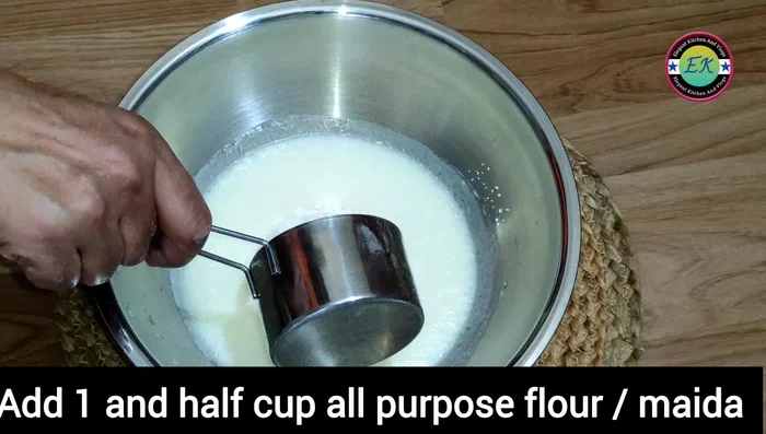 Add 1 1/2 cups of all-purpose flour and 1 1/2 cups of wheat flour (or 3 cups of all-purpose flour if preferred). Mix.