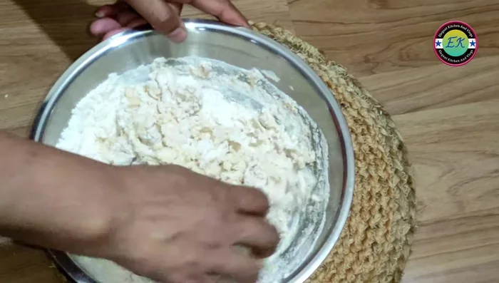 Add water gradually, kneading until you have a slightly looser dough than for roti. Add the remaining 1/2 teaspoon of oil and knead for 1-2 minutes.