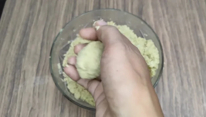 Take small portions of the dough and shape them into small patties. You can flatten them on a banana leaf.