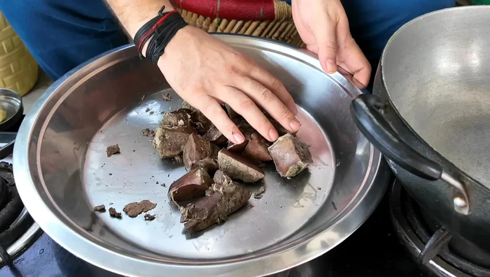 Once cooled, mix the steamed liver with ginger, garlic, chili flakes, chaat masala powder, black pepper powder, salt, and lemon juice.