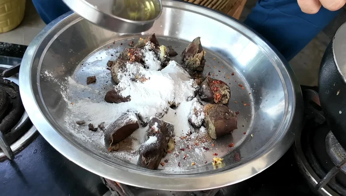 Add rice flour and a little refined oil to the mixture and mix well to create a slightly sticky consistency.