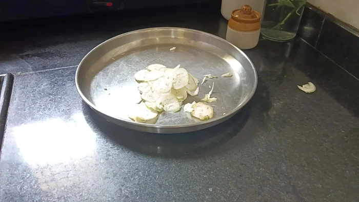 Remove banana chips from oil and let them cool.