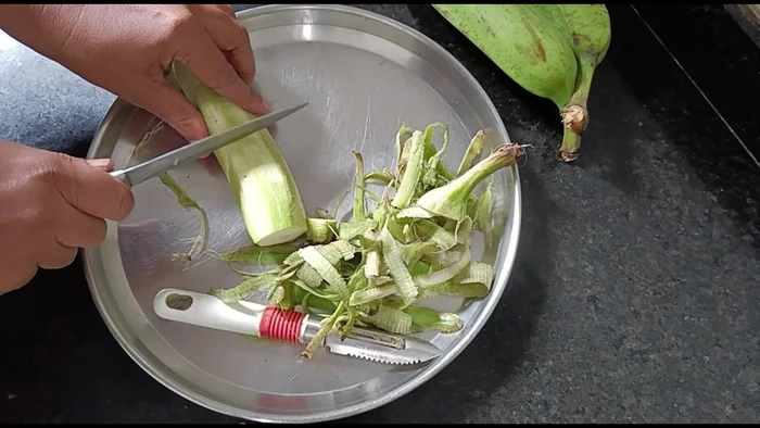 Peel and slice three raw bananas into two pieces each. Don't worry if they turn black.