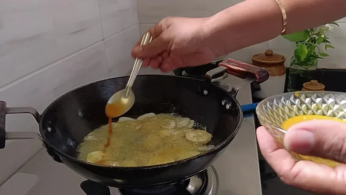 If using a chip maker, arrange banana slices and add the turmeric-salt water mixture. Fry on medium flame until crispy.