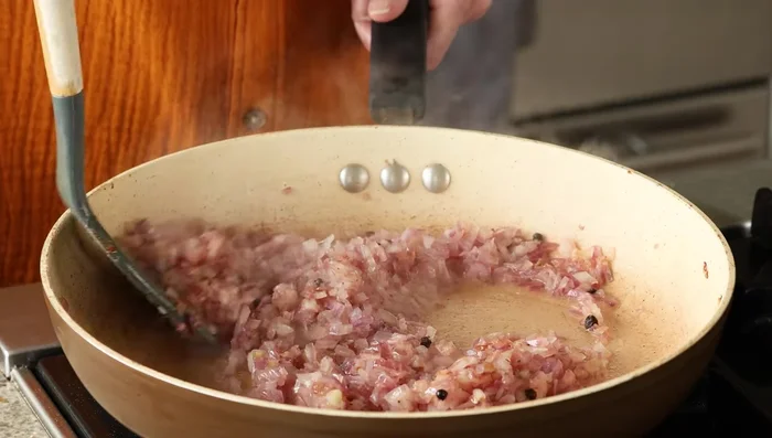 Add garlic and cook until onion is golden.