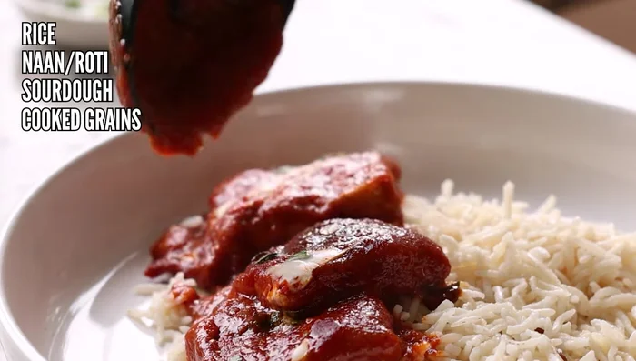 Serve over rice, naan, roti, sourdough, or another grain of your choice.