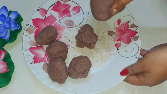 Make medium-sized balls from the dough. Lightly flatten each ball.