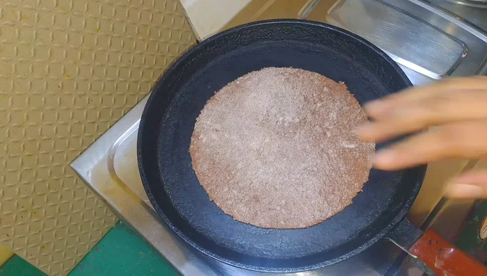 Heat a tawa over high heat. Cook the roti on both sides until lightly browned.