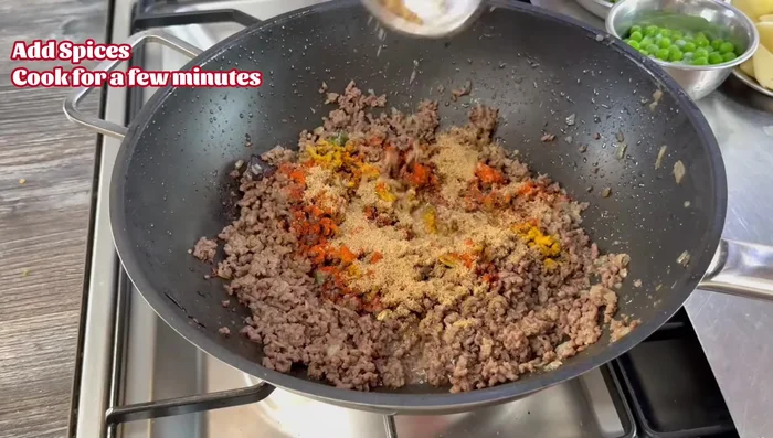 Add turmeric, Kashmir chili powder, and coriander. Stir for a couple of minutes. Add 2 tablespoons of water if needed to prevent sticking.