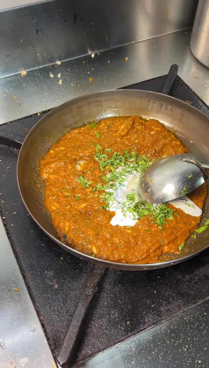 Garnish with butter and green coriander.
