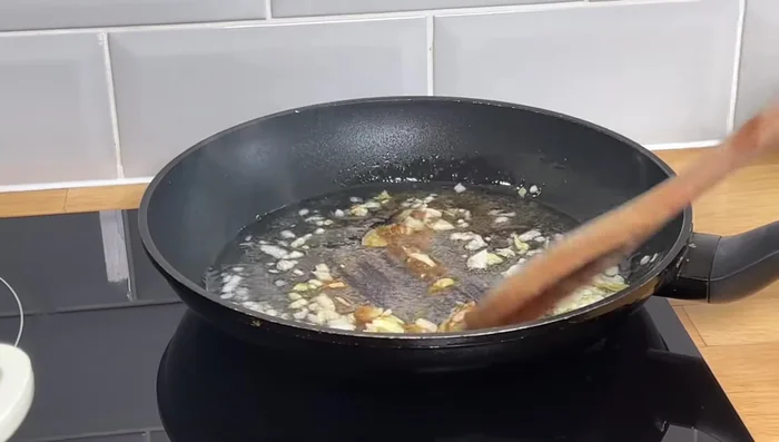 Add garlic, cumin, and oregano. If cooking on high heat, it's better.
