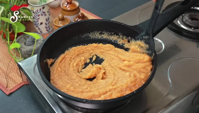 Continue stirring constantly until the mixture thickens and coconut oil separates (about 10-15 minutes). Maintain medium heat.