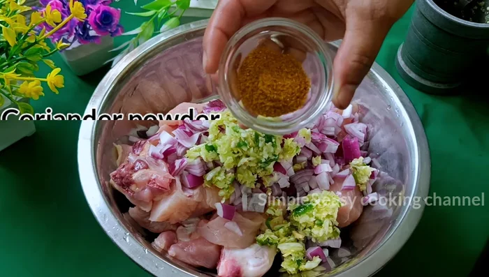 Once the chicken is cooked, sprinkle the roasted sesame seeds over it.