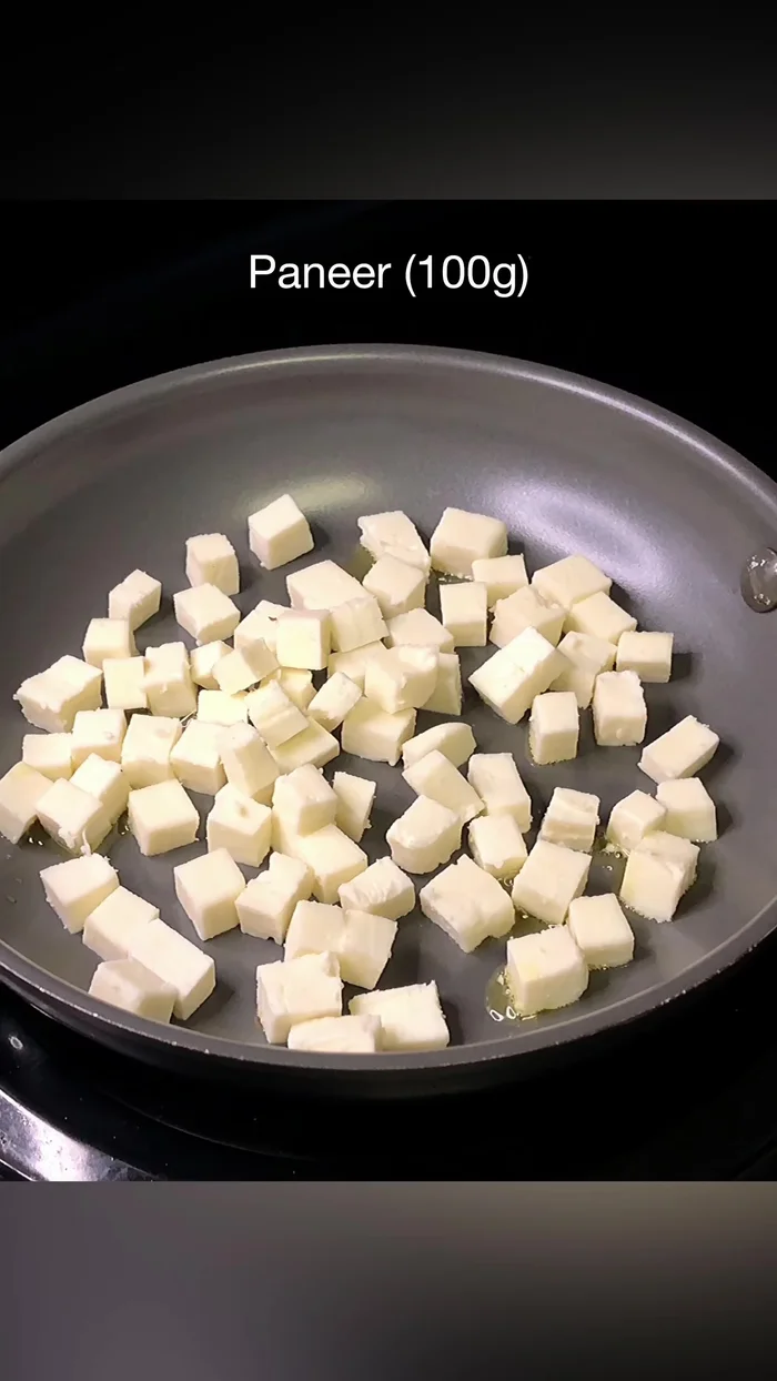 Stir-fry paneer with olive oil, salt, red chili flakes (optional), and dried oregano until slightly golden brown.
