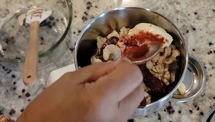 Add soaked cashews and red chili to the mixture (759.92).
