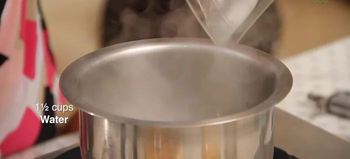 Boil 1.5 cups of water. Add pounded ginger and cardamom to the boiling water.