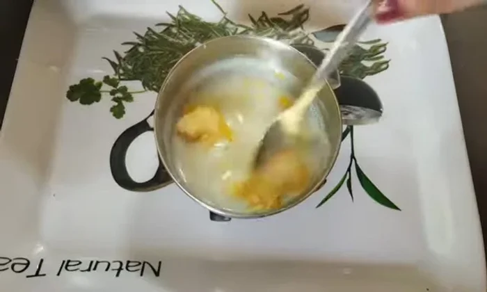 Mix vanilla custard powder (or arrowroot powder) into a separate bowl until smooth to avoid lumps.
