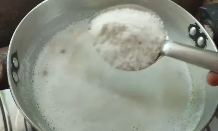 Add sugar to the heated milk and stir until dissolved.