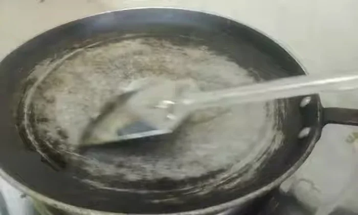 Heat oil in a pan. Spread bread pieces evenly and bake for less than a minute per side, turning to ensure even cooking.