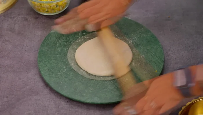 Roll out the stuffed dough into a paratha. Don't roll too thin if using a lot of stuffing.