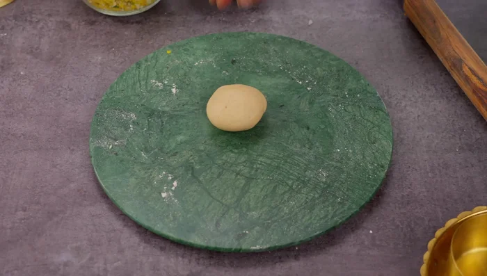 Method 2 (traditional): Flatten dough, create a well in the center using your thumbs and fingers, add stuffing, and seal the edges by twisting.