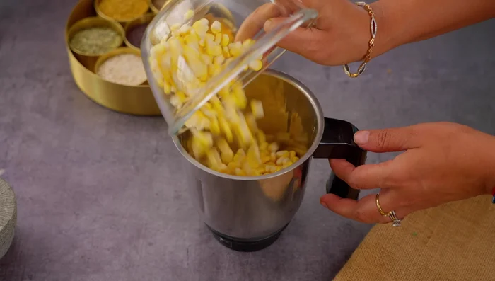 Grind fresh corn coarsely. If using frozen corn, thaw it first.