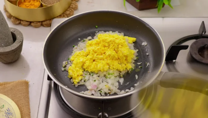 Add the ground corn, salt, and mix well. Fry for 30 seconds on medium heat until slightly dry.
