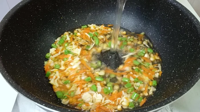 Add three cups of water, salt, and pepper. Bring to a boil and simmer for 5 minutes.