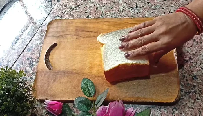 Cut off the crusts of 6 slices of white bread and cut each slice into 4 small squares. (15.04)