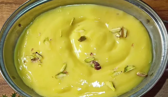 Arrange the toasted bread squares on top of the custard, partially dipping them. (386.08)