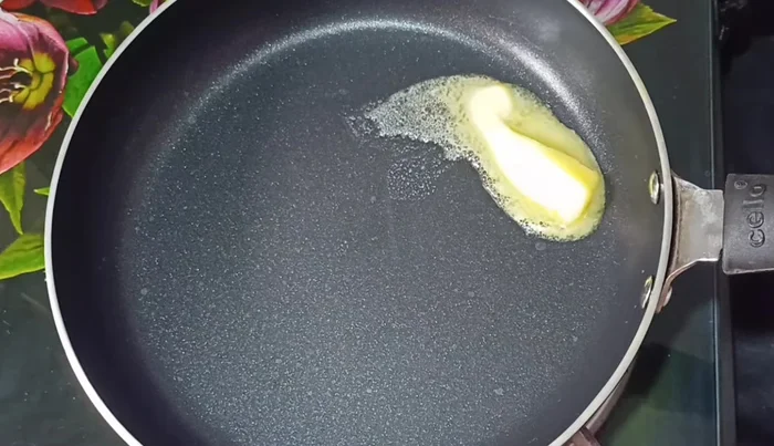 Toast the bread squares in a pan with butter (or ghee/oil) until lightly golden brown on both sides. (89.439)