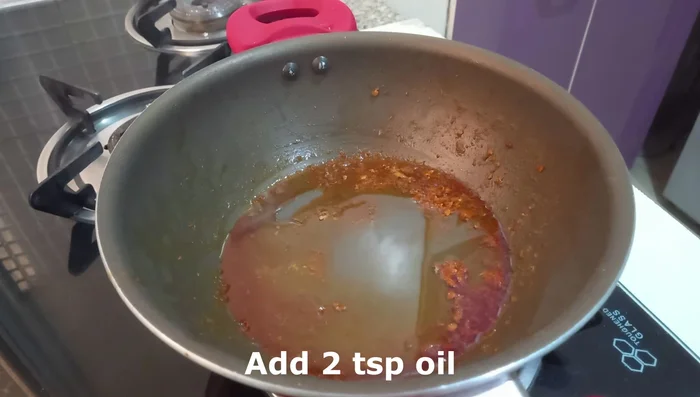 Add more oil to the pan. Add mustard seeds and curry leaves, then add chopped onions and fry for 2-3 minutes.