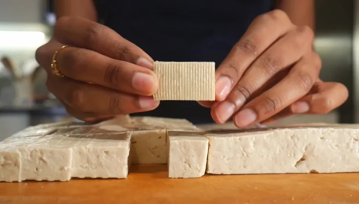 Drain and cut tofu into chunks. Roughly chop vegetables.