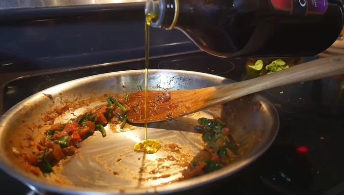 Add oil to the pan, and cumin seeds. Add the blended curry base and 1/2 cup of water.