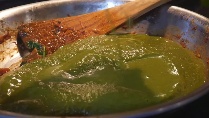 Add chili powder, garam masala, sugar, and salt to taste. Top with fried tofu cubes.
