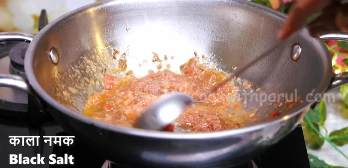 Add Kasuri Methi, black salt, and white salt (adjust to taste). Cook until tomatoes soften.