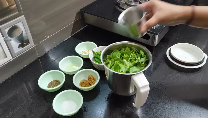 Add about a cup of water to the mixie jar and blend until you get a fine paste.