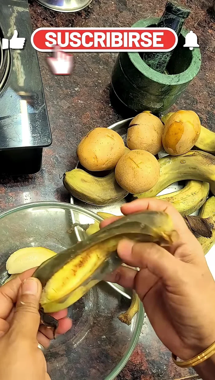Once boiled and cooled, peel and mash the bananas and potatoes.