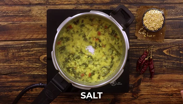 Let the pressure release naturally. Once released, add salt and tamarind extract (95.2). Simmer for 5 minutes (102.24).