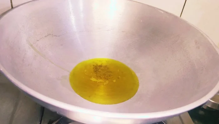 Heat oil in a pan. Add cumin seeds and bay leaves once the oil is hot.