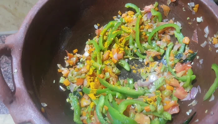 Add turmeric powder and Kashmiri chili powder for color.